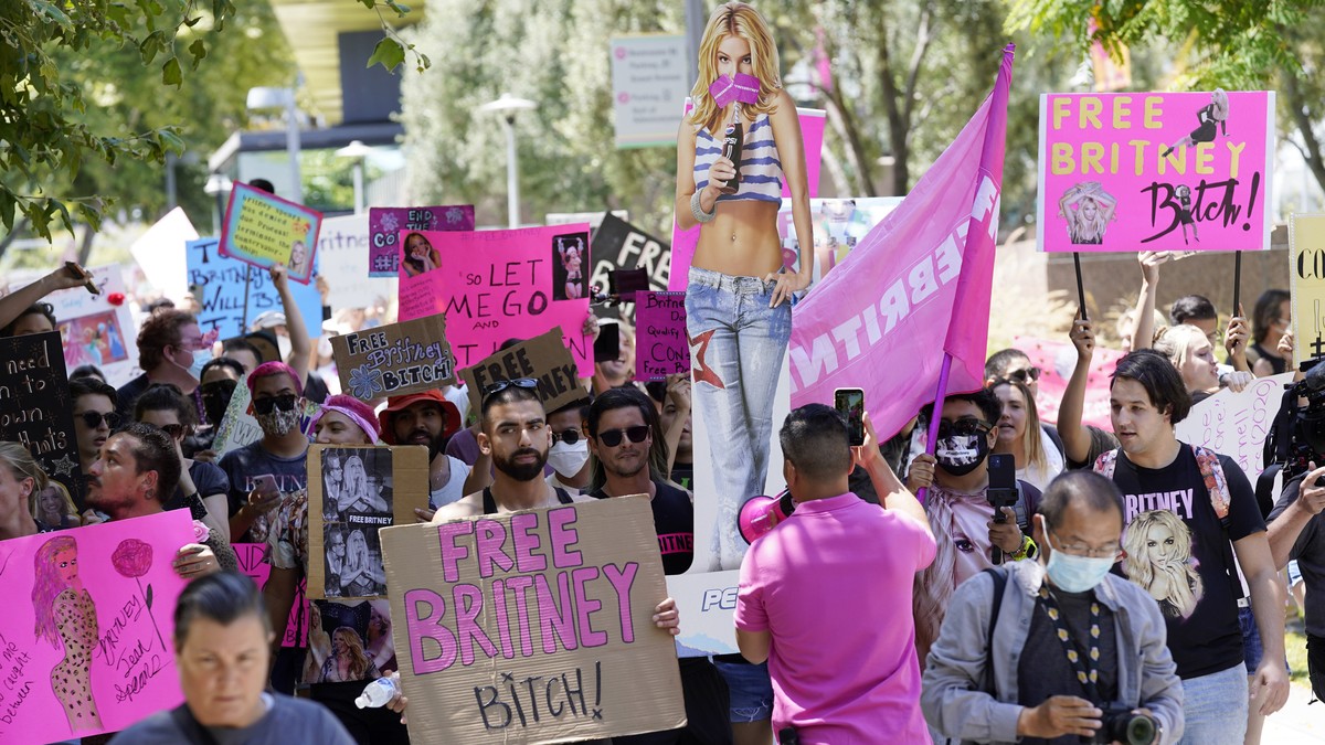EDS NOTE: OBSCENITY - Britney Spears supporters march outside a court hearing concerning the pop singer's conservatorship at the Stanley Mosk Courthouse, Wednesday, June 23, 2021, in Los Angeles. ...
