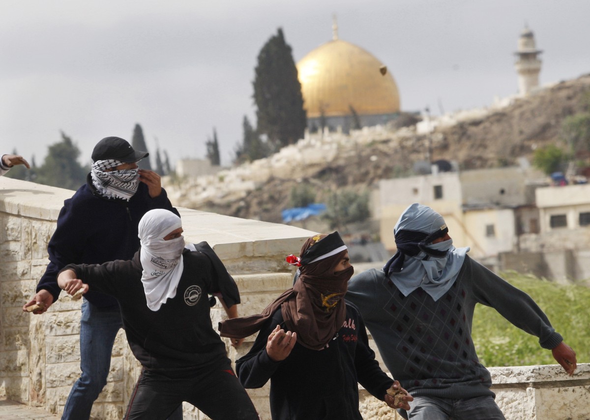 FILE - In this March 16, 2010 file photo, Palestinian demonstrators hurl stones at Israeli troops in east Jerusalem. After finding high-tech solutions to halt suicide bombings and rockets, tech-savvy  ...