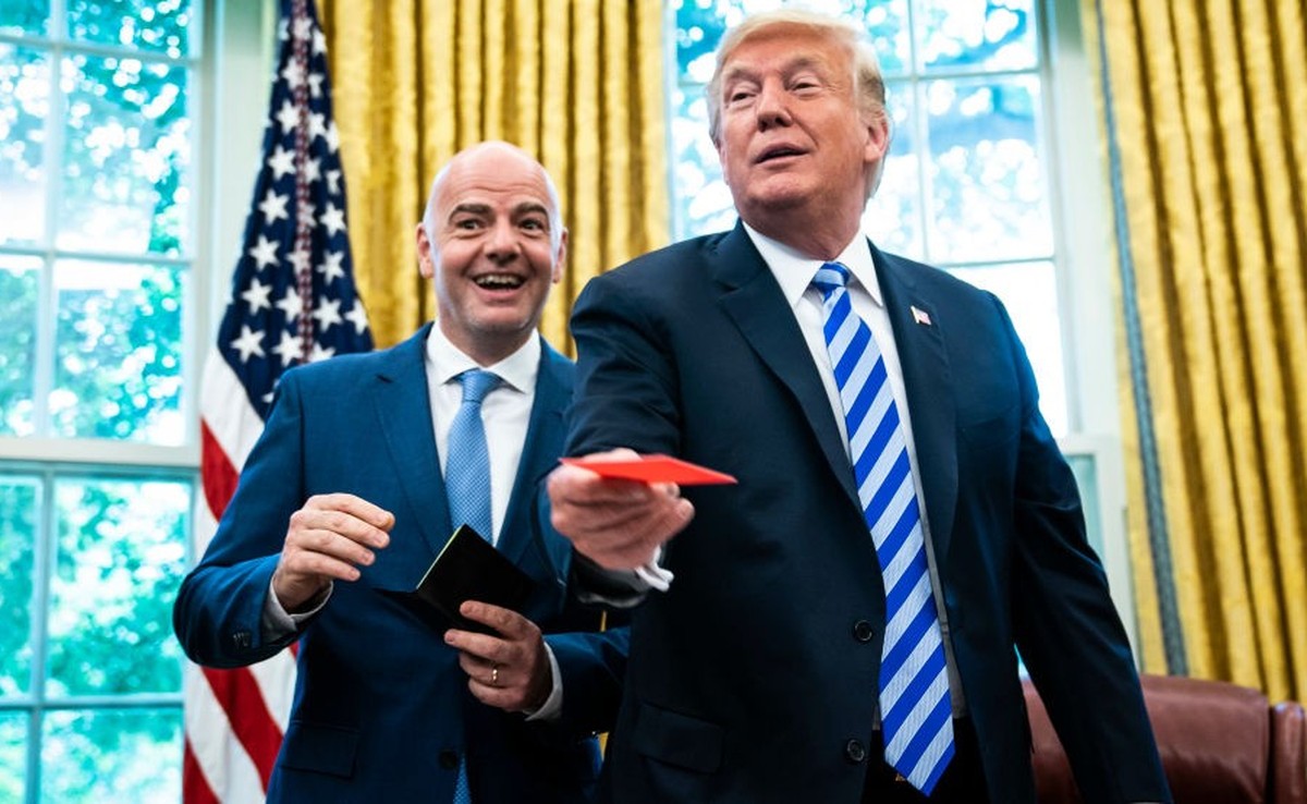 WASHINGTON, DC - AUGUST 28 : President Donald J. Trump is given a red card by FIFA President Gianni Infantino during a meeting in the Oval Office of the White House on Tuesday, Aug 28, 2018 in Washing ...