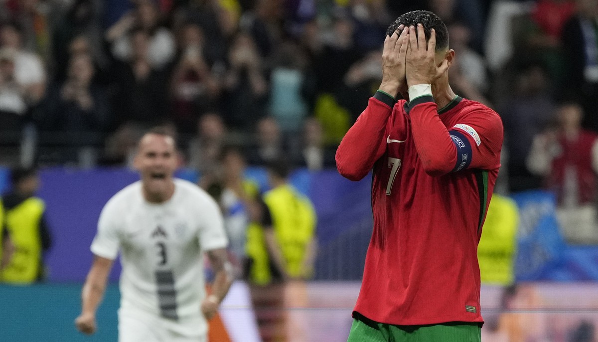 Portugal's Cristiano Ronaldo reacts after he failed scoring a penalty during a round of sixteen match between Portugal and Slovenia at the Euro 2024 soccer tournament in Frankfurt, Germany, Monda ...