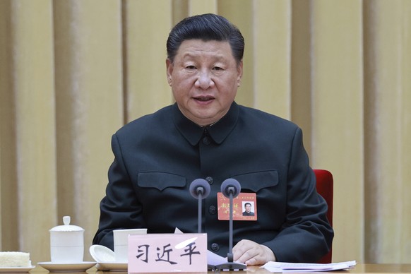 In this photo released by Xinhua News Agency, Chinese President Xi Jinping, also general secretary of the Communist Party of China Central Committee and chairman of the Central Military Commission (CM ...