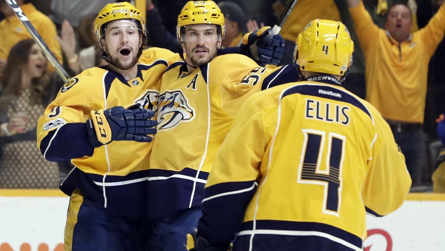 Nashville Predators defenseman Roman Josi (59), of Switzerland, celebrates with Filip Forsberg (9), of Sweden, and Ryan Ellis (4) after Josi scored against the Chicago Blackhawks during the second per ...