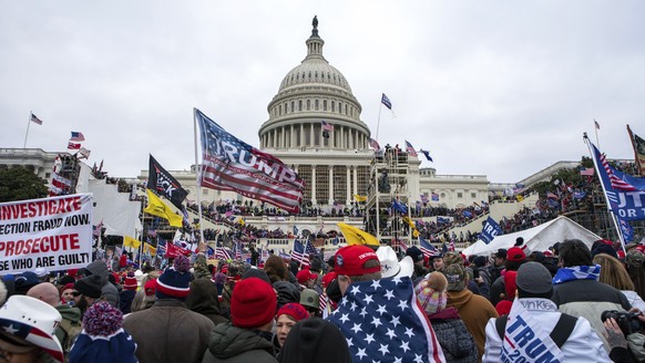 Supporters of President Donald Trump rally at the U.S. Capitol on Jan. 6, 2021, in Washington. As a winter storm bore down on the nation's capital four years later, lawmakers would again gather a ...