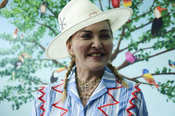 FILE - In this July 16, 2018 file photo, U.S. singer Madonna speaks to the press at a news conference in Blantyre, Malawi. Madonna is celebrating her upcoming 60th birthday with a fundraiser to raise  ...