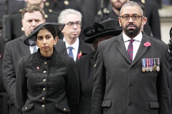 Britain&#039;s Home Secretary Suella Braverman stands with Foreign Secretary James Cleverly to attend the Remembrance Sunday service at the Cenotaph on Whitehall in London, Sunday, Nov. 12, 2023. Ever ...