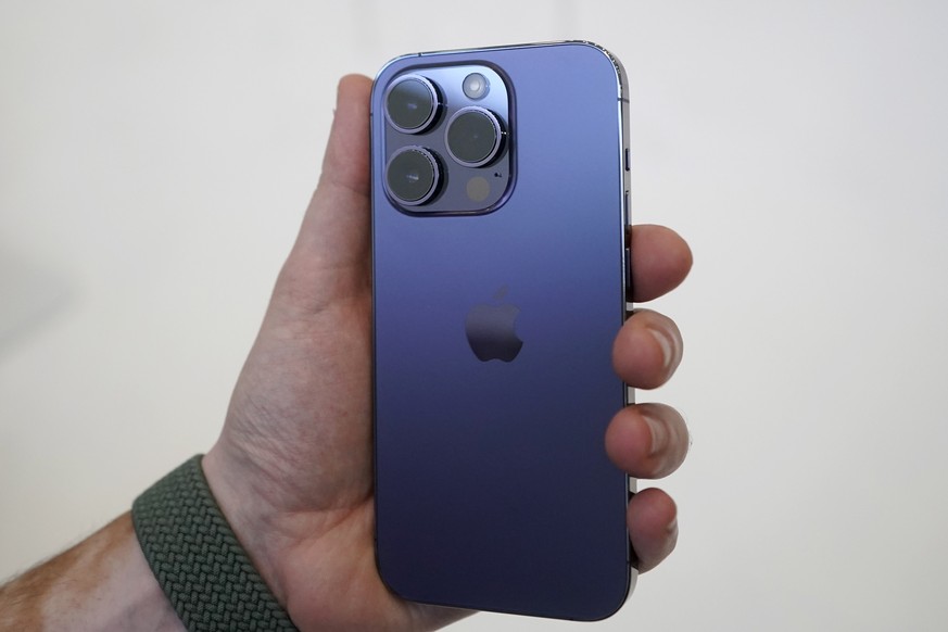 A person holds an iPhone 14 Pro at an Apple event on the campus of Apple&#039;s headquarters in Cupertino, Calif., Wednesday, Sept. 7, 2022. (AP Photo/Jeff Chiu)