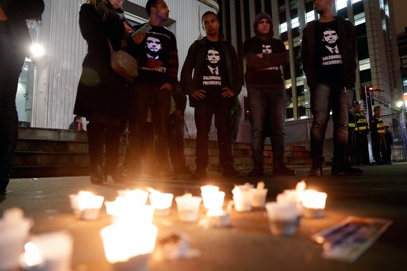 epa07002196 Supporters of Brazilian presidential candidate Jair Bolsonaro hold a vigil on Avenida Paulista in Sao Paulo, Brazil, 06 September 2018. Bolsonaro, who is leading in the polls for the Octob ...