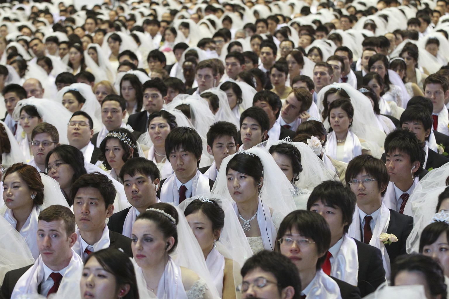 Couples from around the world participate in a mass wedding ceremony at the Cheong Shim Peace World Center in Gapyeong, South Korea, Tuesday, March 3, 2015. 3,800 couples from more than fifty countrie ...