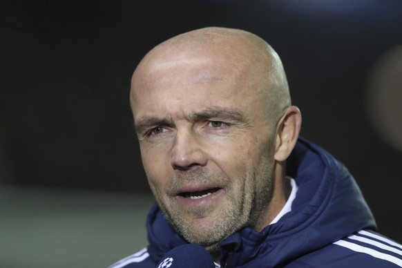 FILE - Ajax&#039;s head coach Alfred Schreuder speaks to the media ahead of the start of the Champions League group A soccer match between, Glasgow Rangers and Ajax, at Ibrox stadium in Glasgow, Scotl ...