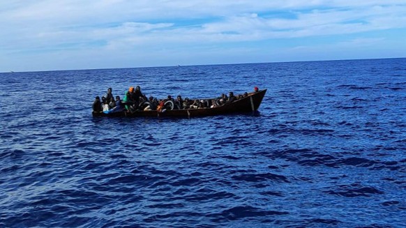 epa10611510 Migrants pictured after they were rescued in Lampedusa, Italy, 06 May 2023. More than 30 migrants, were rescued by the NGO ship Nadir and three fishing boats, and then transferred to the C ...