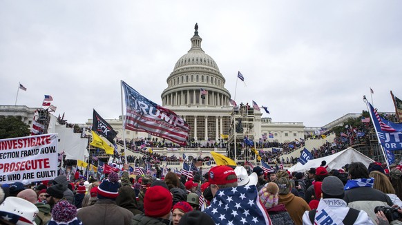 Supporters of President Donald Trump rally at the U.S. Capitol on Jan. 6, 2021, in Washington. As a winter storm bore down on the nation's capital four years later, lawmakers would again gather a ...