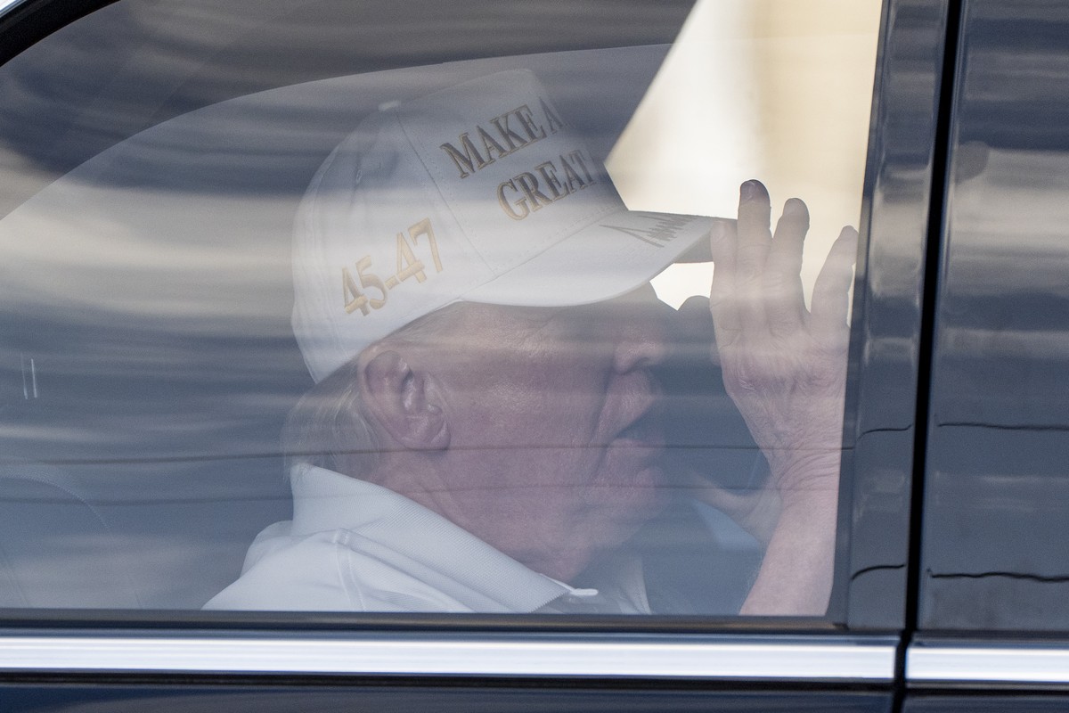 President Donald Trump talks on the phone as he arrives at Trump National Golf Club, Sunday, April 6, 2025, in Jupiter, Fla. (AP Photo/Alex Brandon)
Donald Trump