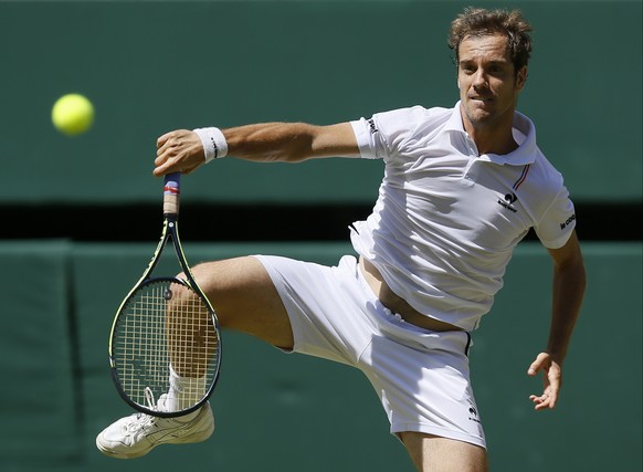 Richard Gasquet of France returns a shot to Novak Djokovic of Serbia, during the men&#039;s singles semifinal match at the All England Lawn Tennis Championships in Wimbledon, London, Friday July 10, 2 ...