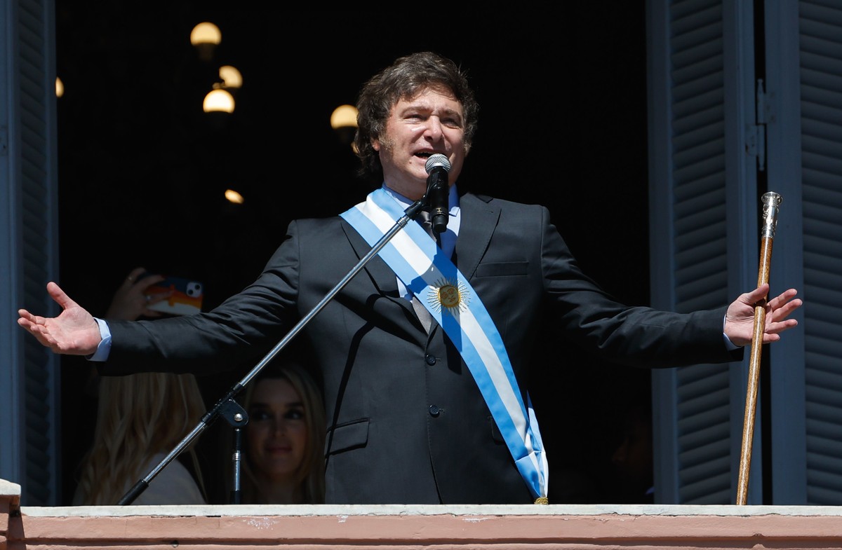 epa11022041 Argentina's President Javier Milei speaks from the balcony of the Casa Rosada in Buenos Aires, Argentina, 10 December 2023. Milei, arrived at the Casa Rosada (seat of government) for  ...