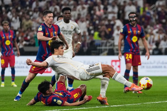 Real Madrid's Gonzalo Garcia scores against FC Barcelona during the Spanish Super Cup final soccer match at King Abdullah Sports City Stadium in Jeddah, Saudi Arabia, Sunday, Jan. 11, 2026. (AP P ...