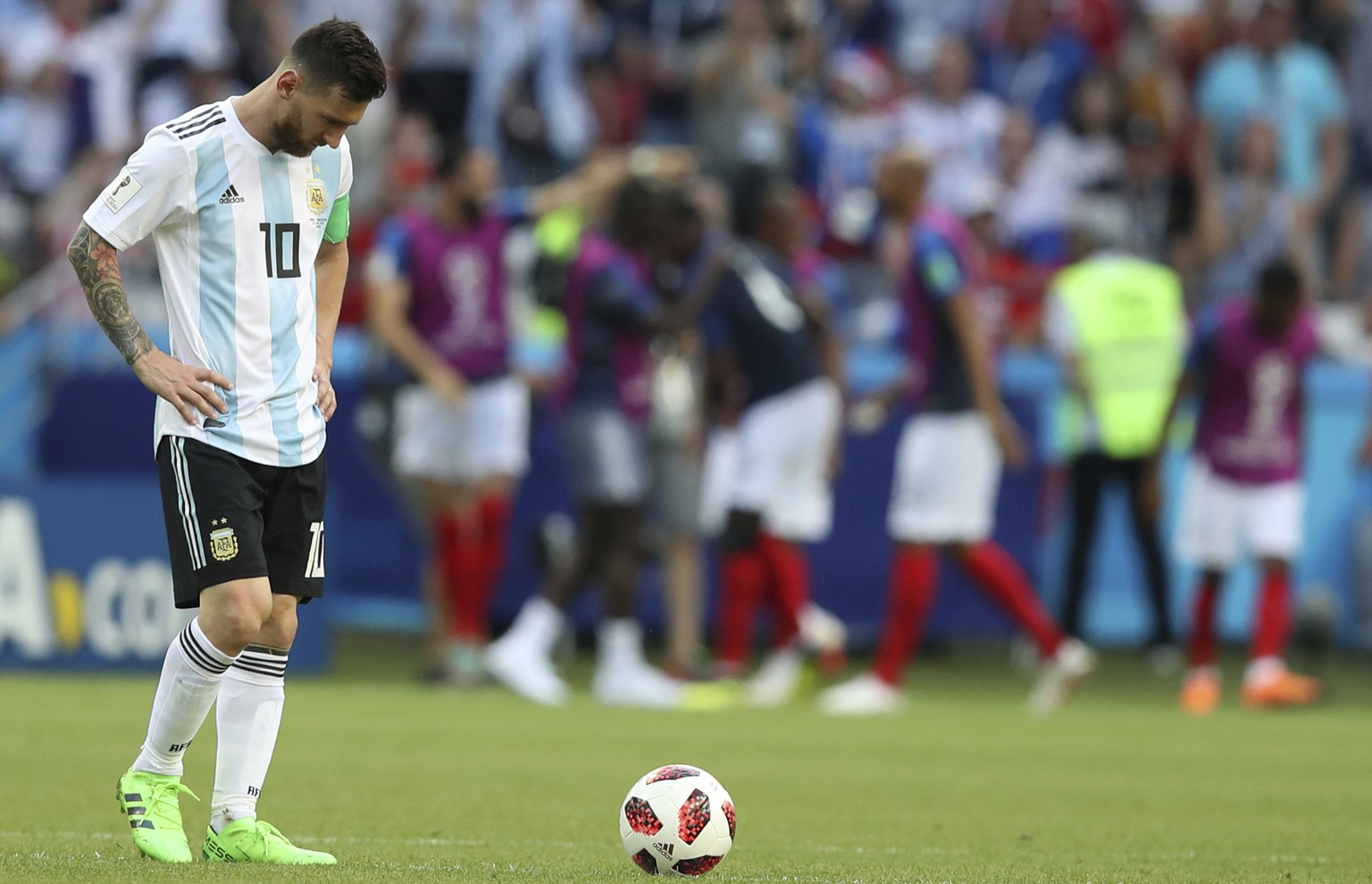 Argentina&#039;s Lionel Messi reacts as France players celebrate taking the lead with their side&#039;s third goal by France&#039;s Kylian Mbappe, during the round of 16 match between France and Argen ...