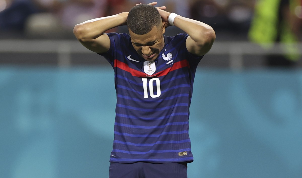 France's Kylian Mbappe reacts after a missed scoring opportunity during the Euro 2020 soccer championship round of 16 match between France and Switzerland at the National Arena stadium, in Buchar ...