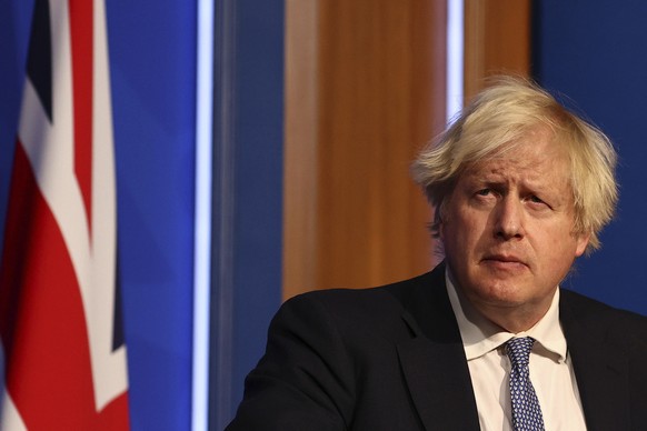 Britain&#039;s Prime Minister Boris Johnson speaks at a press conference in London&#039;s Downing Street, Wednesday Dec. 8, 2021, after ministers met to consider imposing new restrictions in response  ...