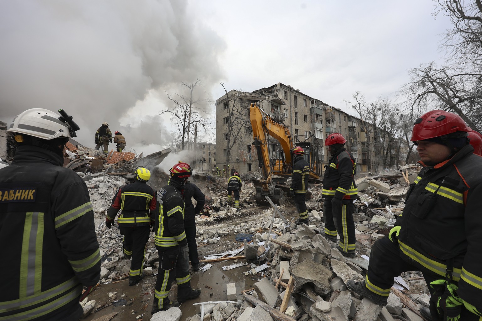 epaselect epa12800980 Ukrainian rescuers work at the site of a strike on a residential building in Kharkiv, northeastern Ukraine, 07 March 2026, amid the Russian invasion. At least seven people died,  ...