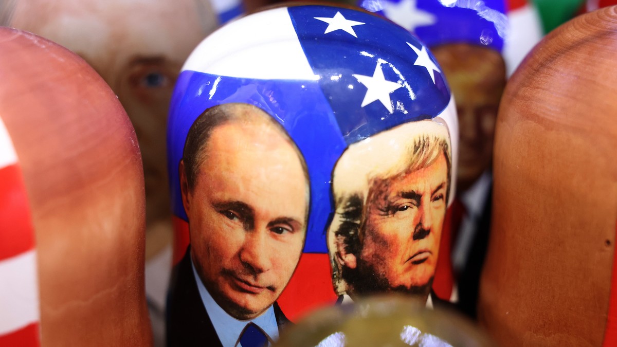epa12294027 Traditional Russian wooden Matryoshka dolls depicting Russian President Vladimir Putin (L) and US President Donald Trump (R) on display for sale at a souvenir market in Moscow, Russia, 11  ...
