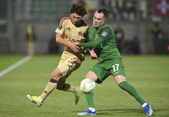 epa11172930 Rick (R) of Ludogorets and Keigo Tsunemoto (L) of Servette in action during the UEFA Europa Conference League knock-out round play-offs, 2nd leg soccer match between Ludogorets and Servett ...