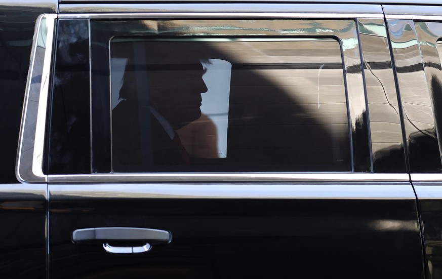 epa10557452 Former US President Donald J. Trump in the back of his armored SUV as he arrives at Trump Tower in New York, New York, USA, 03 April 2023. After being indicted by a Manhattan grand jury la ...