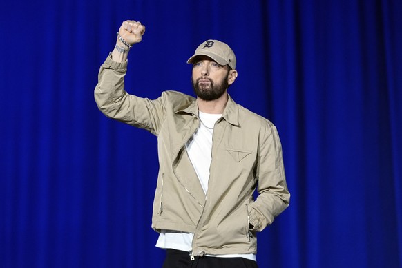 Rapper Eminem arrives to speak before former President Barack Obama at a campaign rally supporting Democratic presidential nominee Vice President Kamala Harris, Tuesday, Oct. 22, 2024, in Detroit. (AP ...