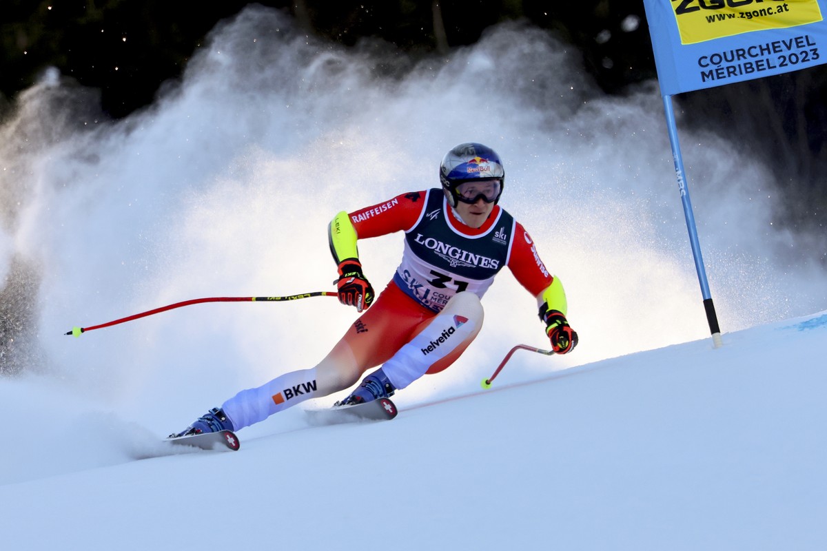 Switzerland's Marco Odermatt speeds down the course during the super G portion of an alpine ski, men's World Championship combined race, in Courchevel, France, Tuesday, Feb. 7, 2023. (AP Pho ...