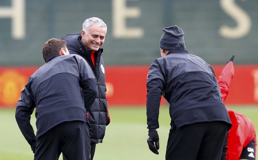 Manchester United manager Jose Mourinho speaks with Nemanja Matic, left, and Zlatan Ibrahimovich, right, during a training session at the AON Training Complex, Carrington, England, Tuesday Nov. 21, 20 ...