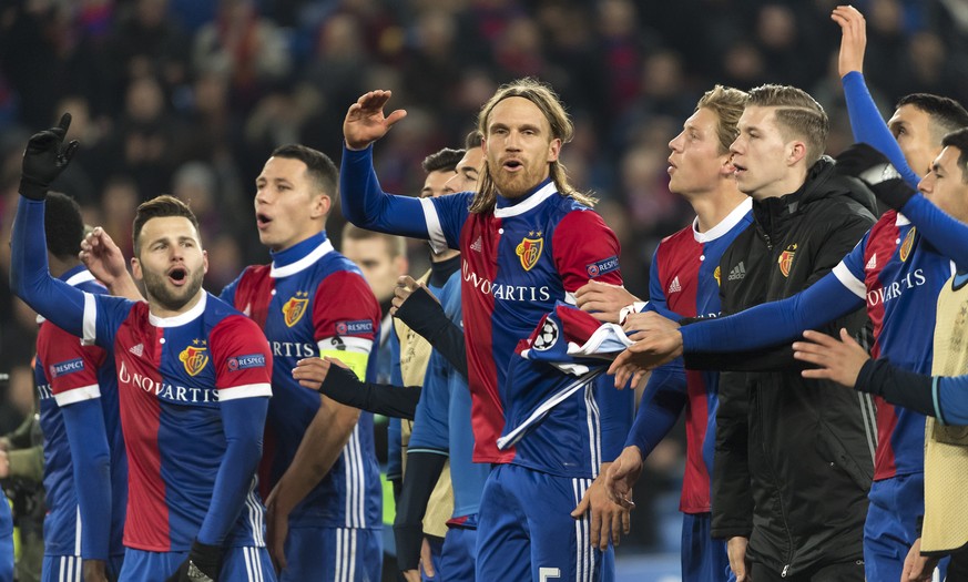 Basel's players cheeer with the fans after winning the UEFA Champions League Group stage Group A matchday 5 soccer match between Switzerland's FC Basel 1893 and England's Manchester United FC at the S ...