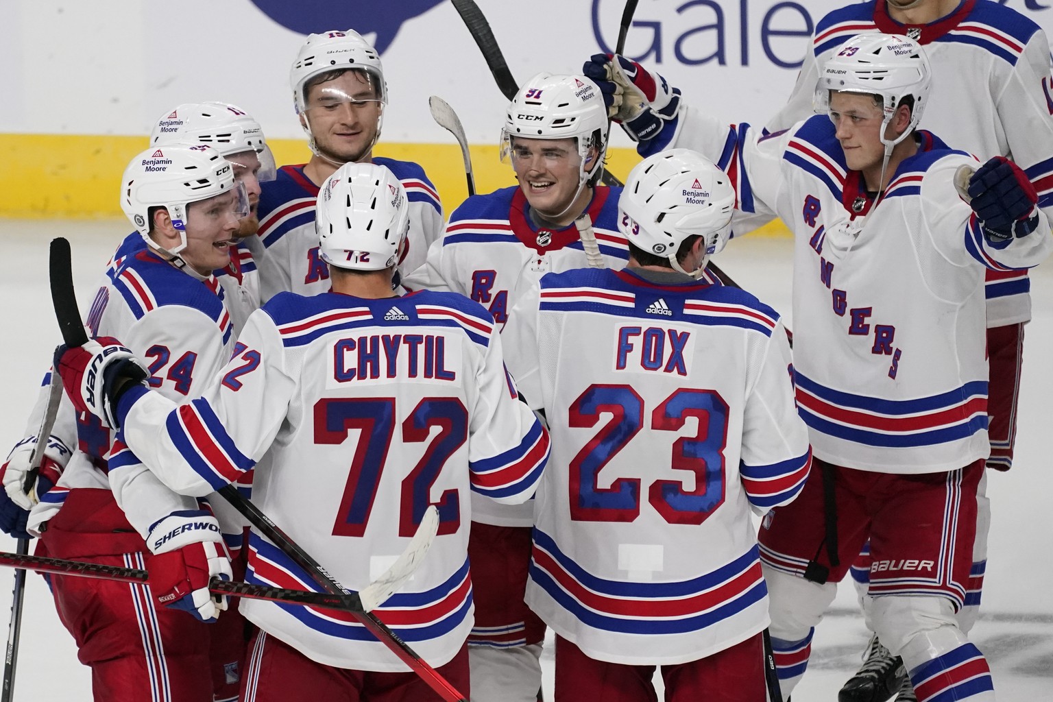 New York Rangers center Filip Chytil (72) celebrates scoring the winning goal with his teammates in overtime of an NHL preseason hockey game against the New York Islanders, Saturday, Oct. 9, 2021, in  ...