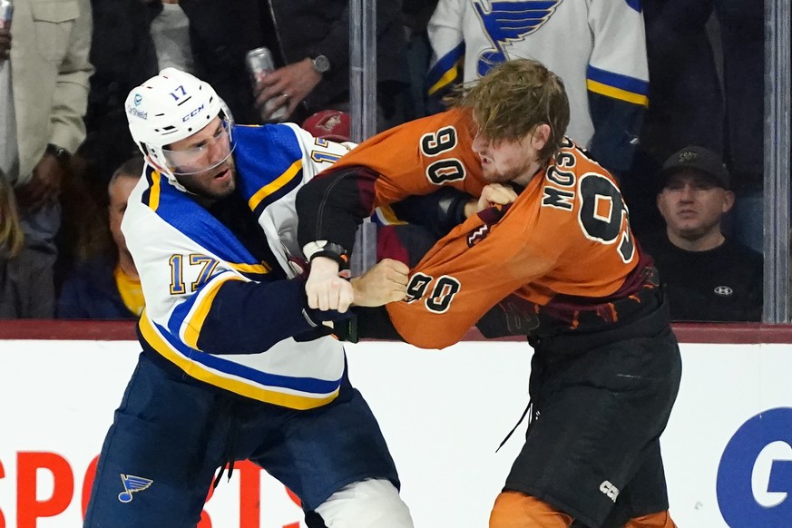 Arizona Coyotes defenseman J.J. Moser (90) fights with St. Louis Blues left wing Josh Leivo (17) during the third period of an NHL hockey game in Tempe, Ariz., Thursday, Jan. 26, 2023. The Coyotes won ...