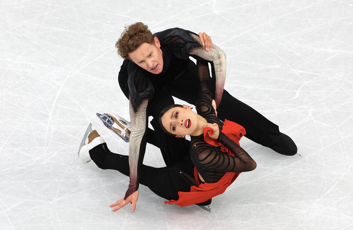 Milan, Italy - February 11, 2026: Madison Chock and partner Evan Bates of United States perform during the Ice Dance Free Dance on day five of the Milano Cortina 2026 Winter Olympic games at Milano Ic ...