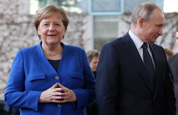 epa08646590 (FILE) - German Chancellor Angela Merkel (L) and Russian President Vladimir Putin (R) during the International Libya Conference in Berlin, Germany, 19 January 2020 (reissued 04 September 2 ...