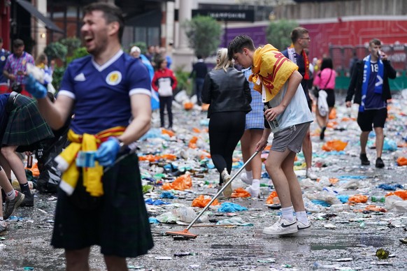 England v Scotland - UEFA EURO, EM, Europameisterschaft,Fussball 2020 - Group D - Wembley Stadium Scotland fans clean up litter in Irving Street near Leicester Square, London, ahead of the UEFA Euro 2 ...