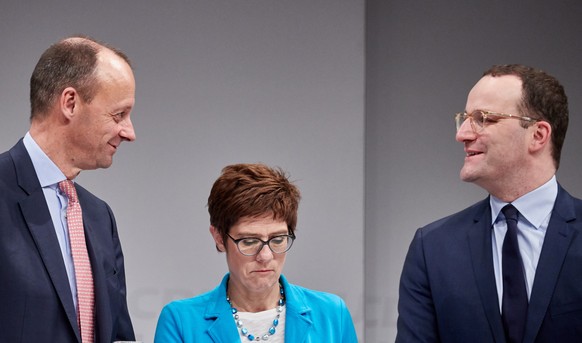 epa07200528 (L-R) The candidates for the leadership of the German Christian Democratic Union (CDU), Friedrich Merz, Annegret Kramp-Karrenbauer and Jens Spahn attend a joint discussion with participant ...