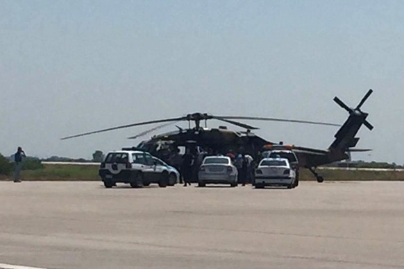 Greek policemen check a Turkish Blackhawk helicopter after landing at the airport of Alexandroupolis, northeastern Greece, on Saturday, July 16, 2016. Greece&#039;s defense ministry says a Blackhawk m ...