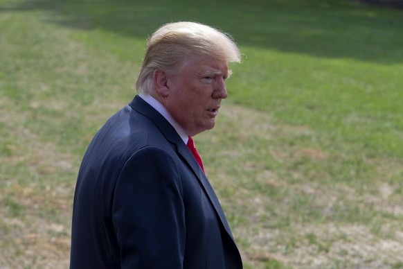 epa06954595 US President Donald J. Trump walks to board Marine One on the South Lawn of the White House in Washington, DC, USA, 17 August 2018. Trump departs the White House for Westhampton Beach, New ...