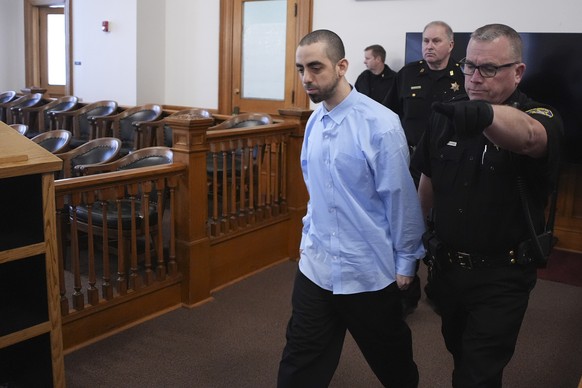 Hadi Matar is escorted into the courtroom at the Chautauqua County Courthouse ahead of the second day in his trial, Tuesday, Feb. 11, 2025, in Mayville, N.Y. Matar is charged with stabbing famed autho ...