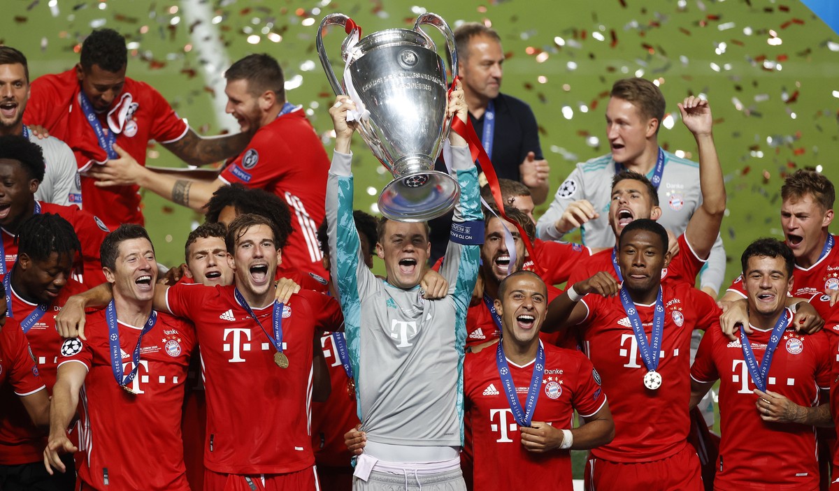 Bayern's goalkeeper Manuel Neuer lifts the trophy after Munich won the Champions League final soccer match between Paris Saint-Germain and Bayern Munich at the Luz stadium in Lisbon, Portugal, Su ...