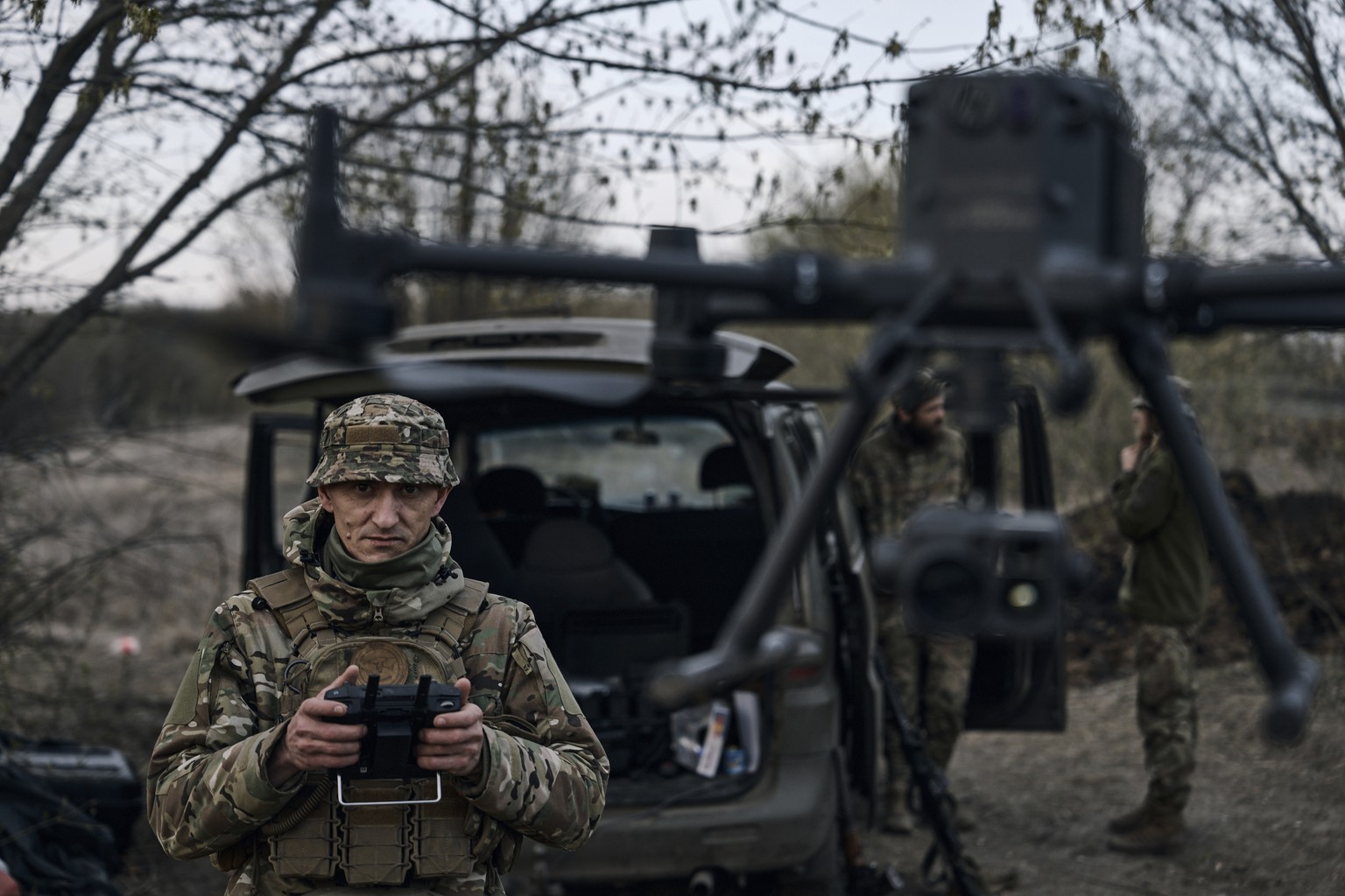FILE - A Ukrainian soldier launches a drone in the area of the heaviest battles with Russian troops in Bakhmut, Donetsk region, Ukraine, Sunday, April 9, 2023. Ukrainian government is launching a new  ...