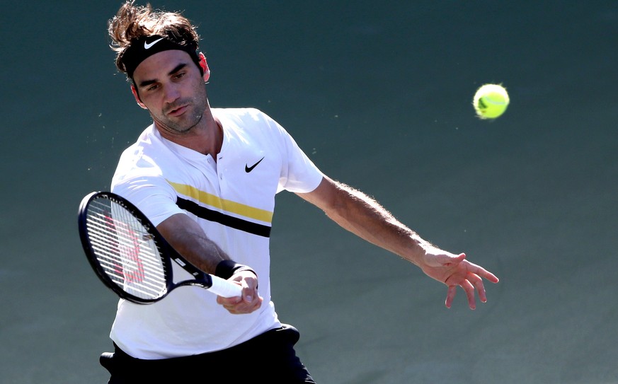 epa06597048 Roger Federer from Switzerland in action against Federico Delbonis of Argentina during the BNP Paribas Open at the Indian Wells Tennis Garden in Indian Wells, California, USA, 11 March 201 ...