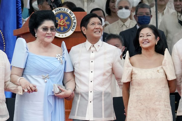 President Ferdinand Marcos Jr. stands with his mother Imelda Marcos, left, and his wife Maria Louise Marcos, right, during the inauguration ceremony at National Museum on Thursday, June 30, 2022 in Ma ...
