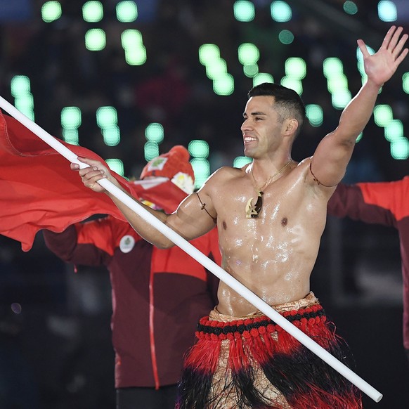 epa06508524 Team Tonga with flag bearer Pita Taufatofua arrive at the Opening Ceremony of the PyeongChang 2018 Olympic Games at the Olympic Stadium, Pyeongchang county, South Korea, 09 February 2018.  ...