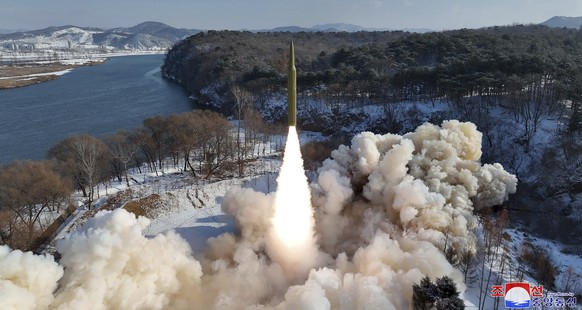 This photo provided by the North Korean government, shows what it says a flight test of a new solid-fuel intermediate-range in North Korea Sunday, Jan. 14, 2024. Independent journalists were not given ...