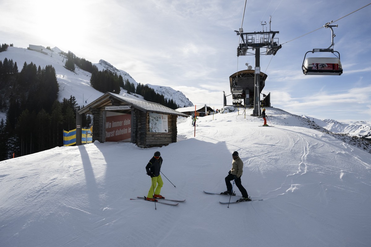 Two skiers wait next to the start hut of the Giant Slalom of the Alpine Skiing FIS Ski World Cup at Adelboden, Switzerland, Wednesday, December 28, 2022. The alpine skiing World Cup men's races a ...