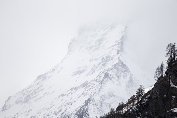 The Matterhorn mountain covered in fog, on Thursday, April 12, 2018, in Zermatt, Switzerland. The rescue team was unable to proceed the rescue operations for the missing German businessman Karl-Erivan ...