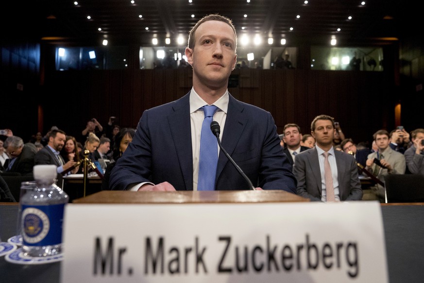 Facebook CEO Mark Zuckerberg arrives to testify before a joint hearing of the Commerce and Judiciary Committees on Capitol Hill in Washington, Tuesday, April 10, 2018, about the use of Facebook data t ...