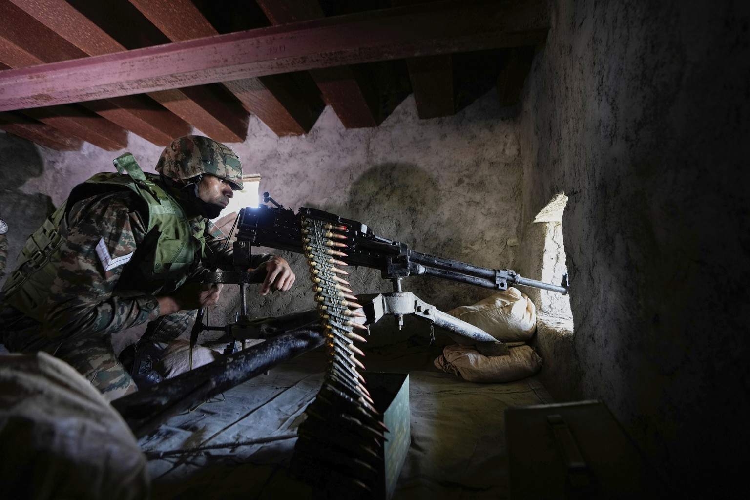 An Indian army soldier mans a forward post along the Line of Control between India and Pakistan during a media tour in Poonch sector, India, Tuesday, May 20, 2025. (AP Photo/Channi Anand)
India Pakist ...