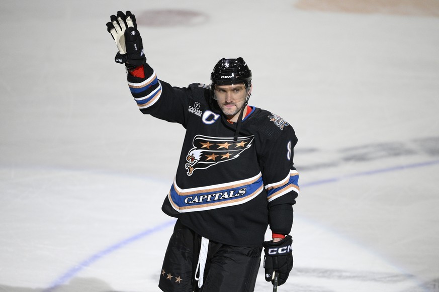 Washington Capitals left wing Alex Ovechkin (8) waves as he continues to celebrate his goal during the third period of an NHL hockey game against the Winnipeg Jets, Friday, Dec. 23, 2022, in Washingto ...